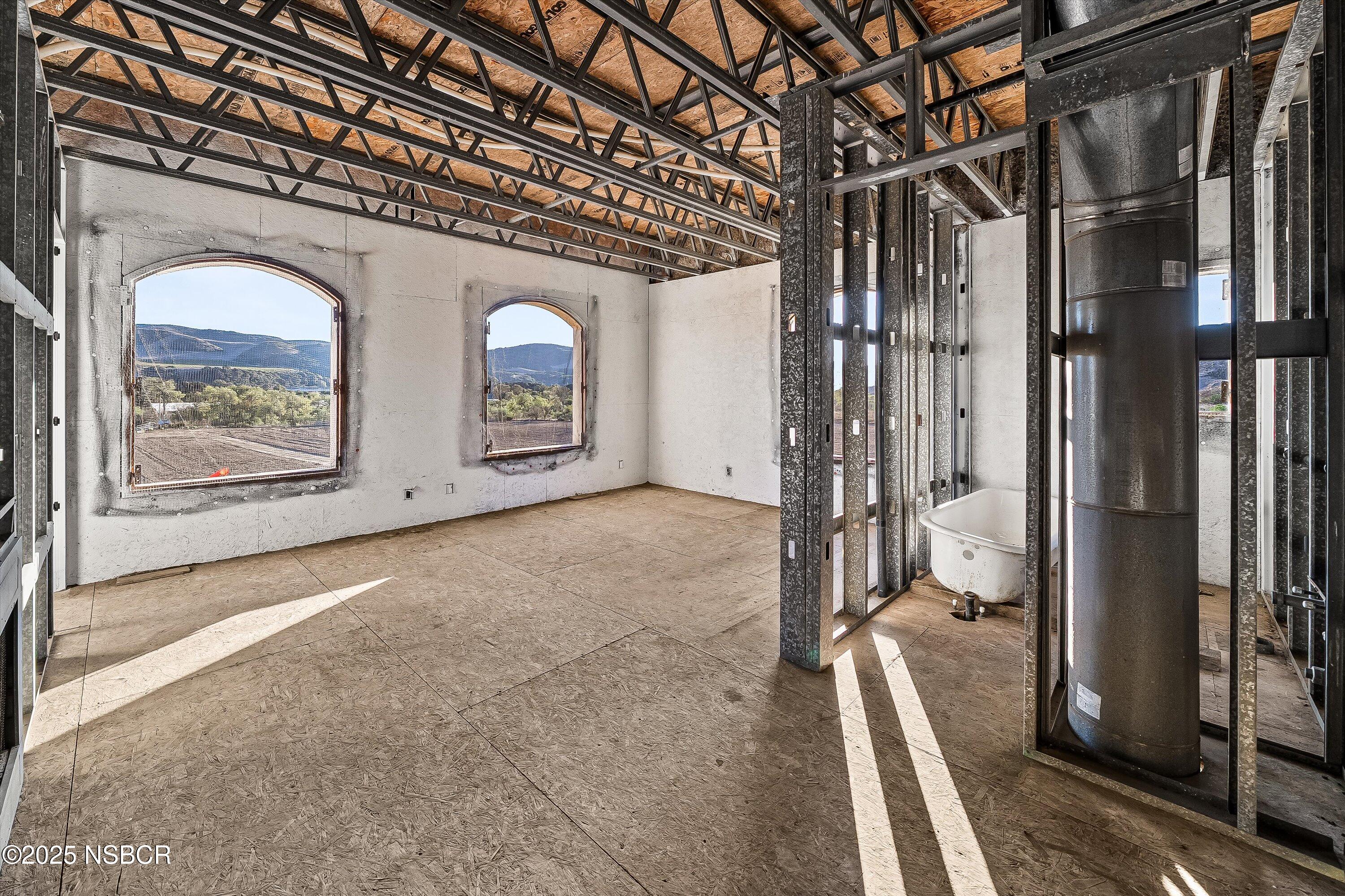 4375 Sweeney Road Lompoc, CA 93436 - Photo 42 of 74 a view of a room with wooden floor and windows