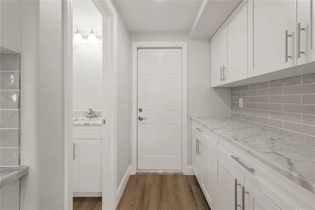 a bathroom with a granite countertop sink