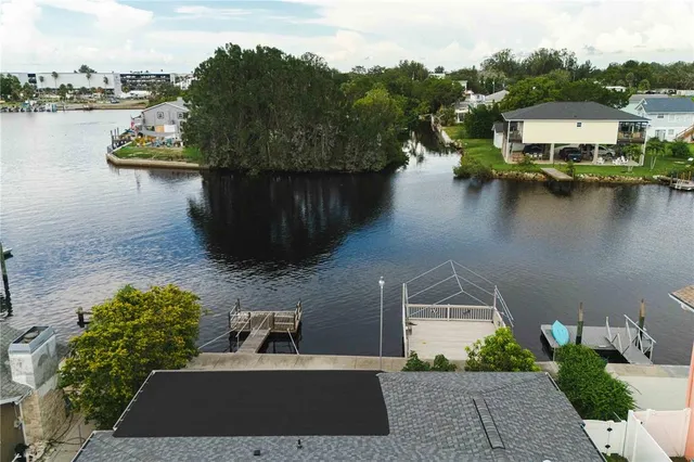 a view of a house with pool table and chairs