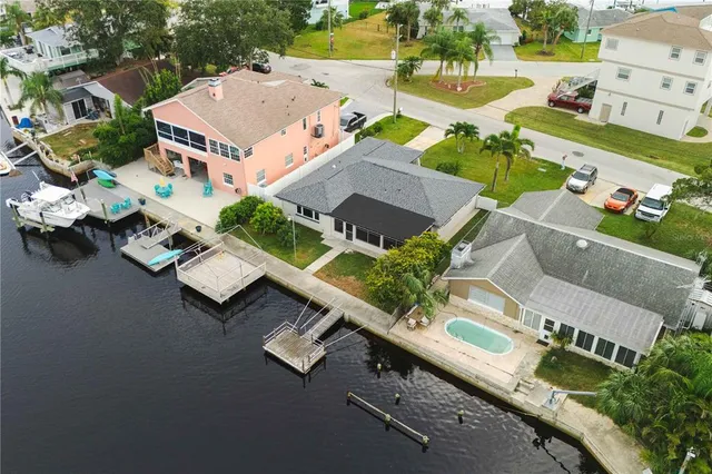 an aerial view of residential house with parking