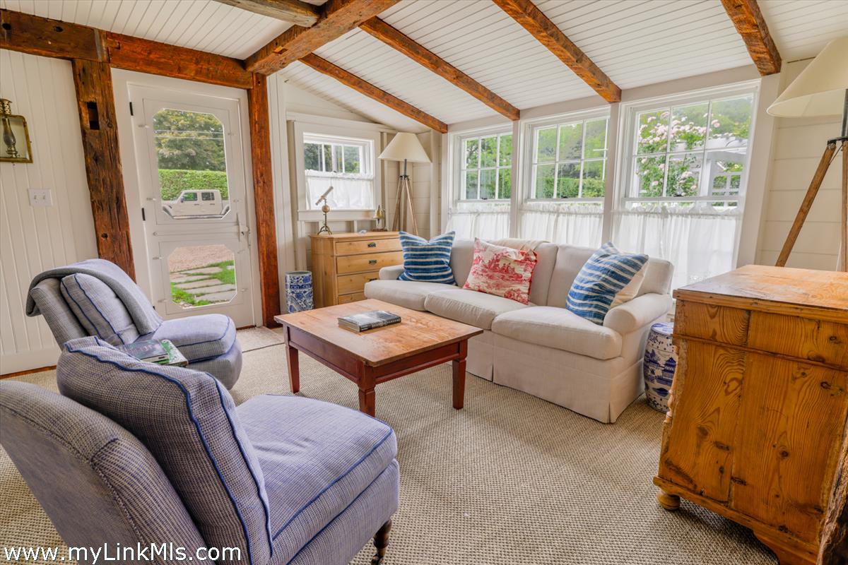 14 & 16 Coffin Street Nantucket, MA 02554 - Photo 30 of 50 a living room with furniture and a window