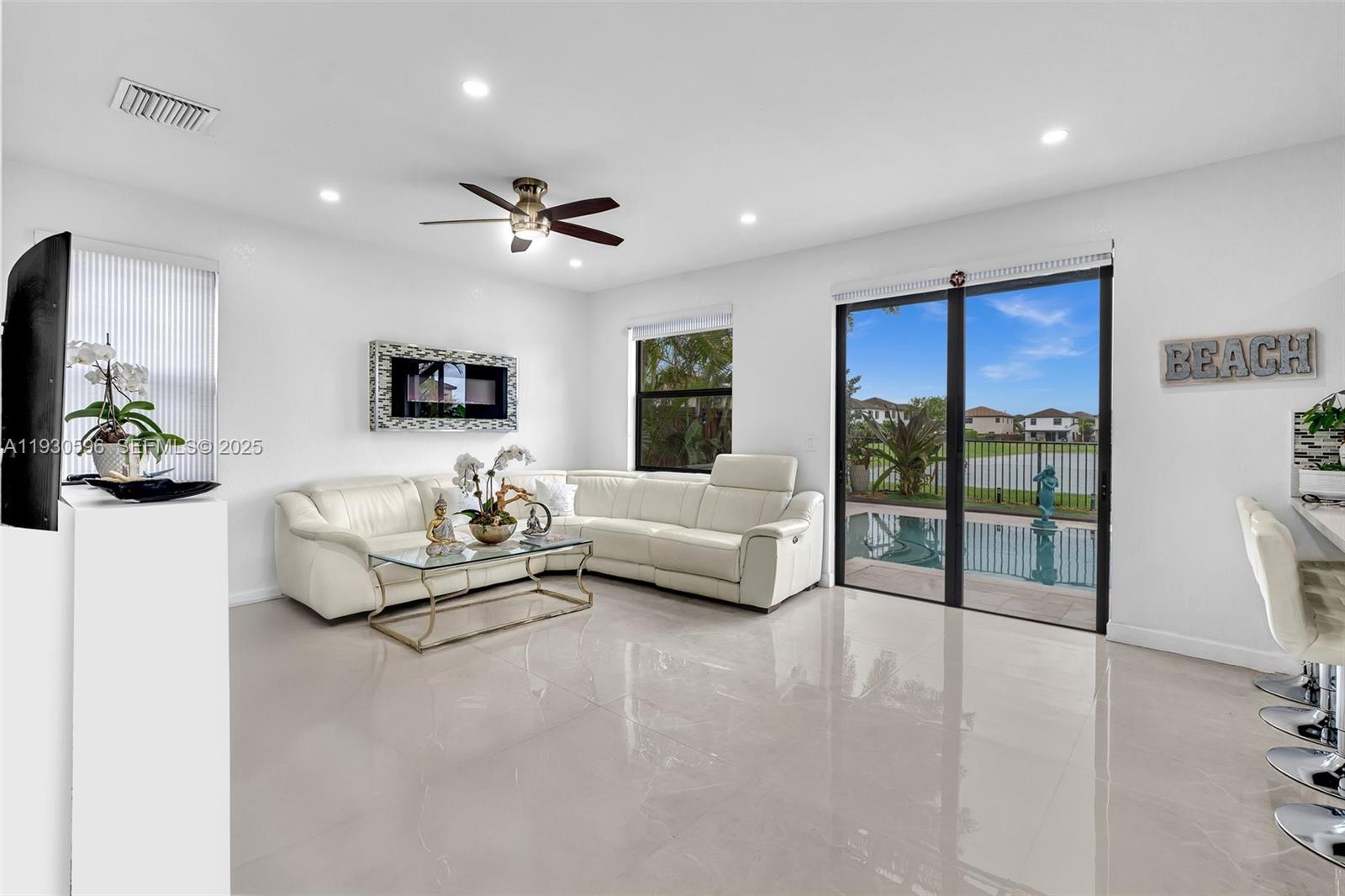 11709 Southwest 253rd Street Homestead, FL 33032 - Photo 13 of 47 a bedroom with furniture and a large window