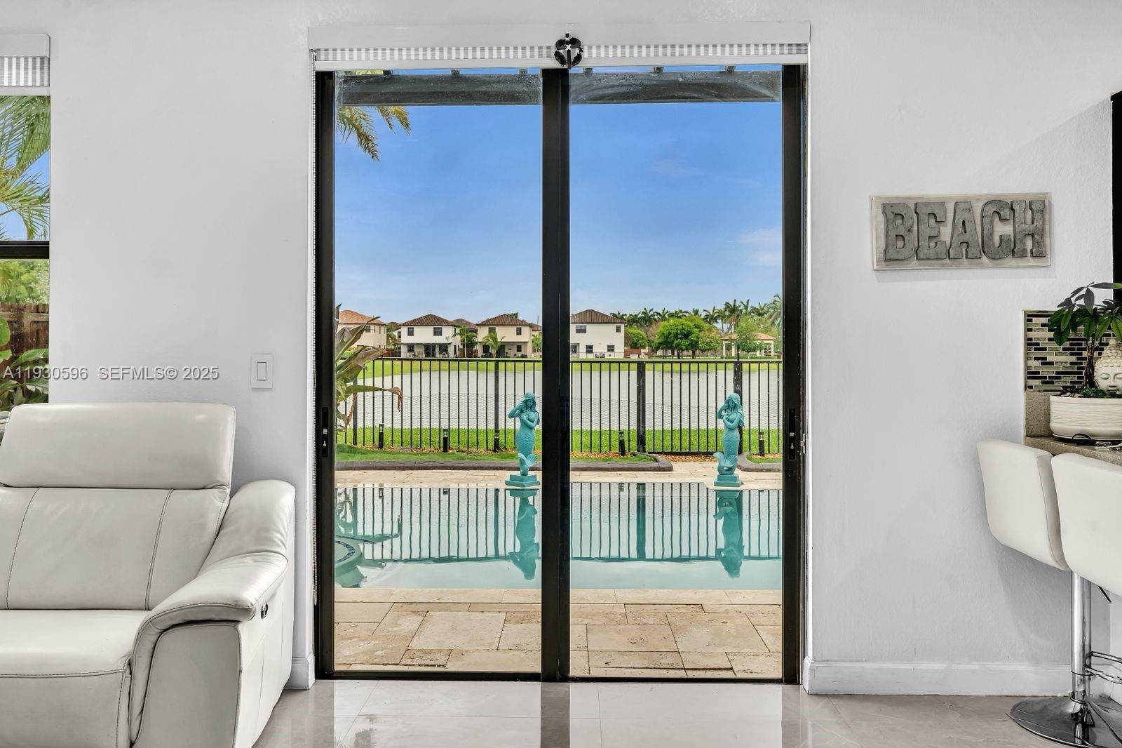 11709 Southwest 253rd Street Homestead, FL 33032 - Photo 14 of 47 a view of a living room and a balcony