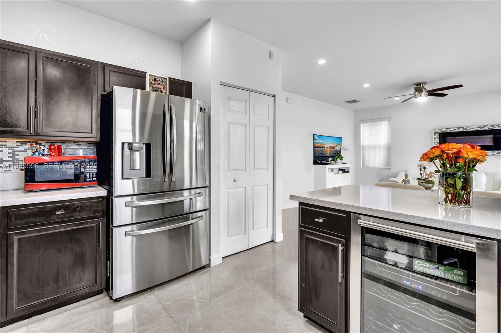 11709 Southwest 253rd Street Homestead, FL 33032 - Photo 16 of 47 a kitchen with stainless steel appliances a refrigerator sink and microwave