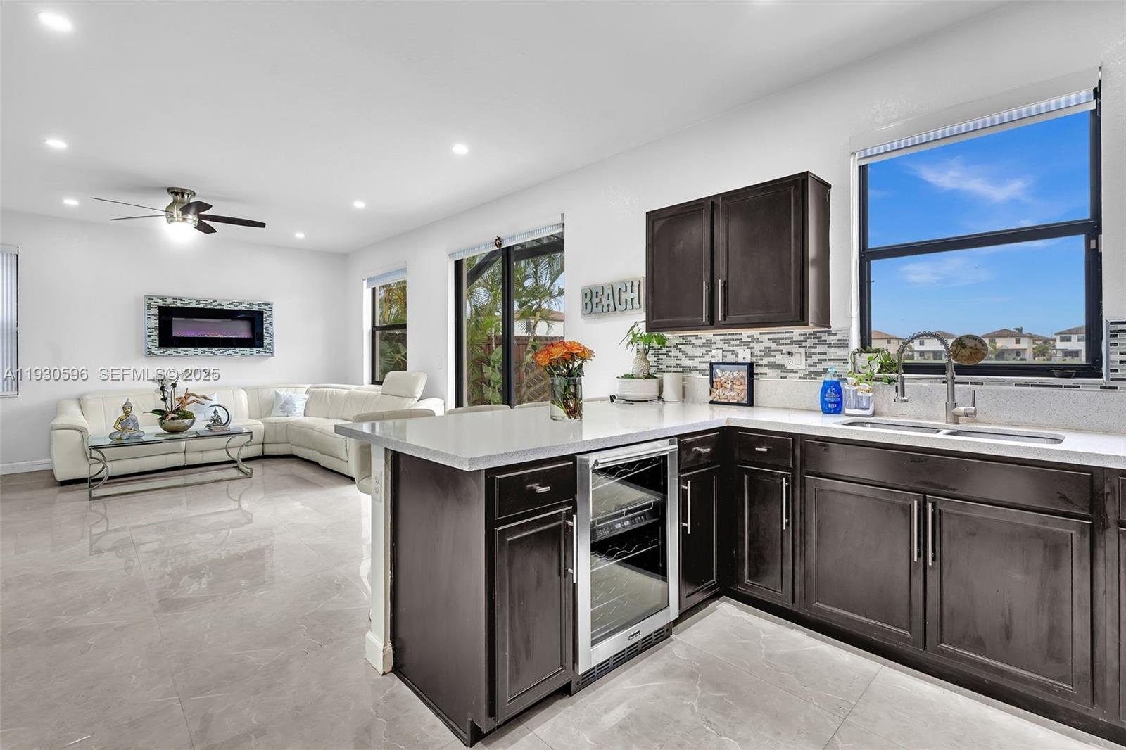 11709 Southwest 253rd Street Homestead, FL 33032 - Photo 17 of 47 a kitchen with a sink stove and cabinets