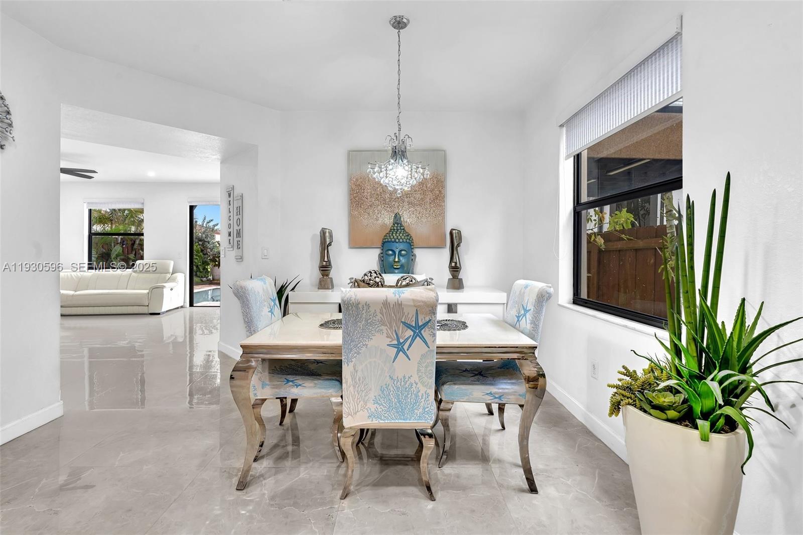 11709 Southwest 253rd Street Homestead, FL 33032 - Photo 29 of 47 a dining room with furniture potted plants and wooden floor
