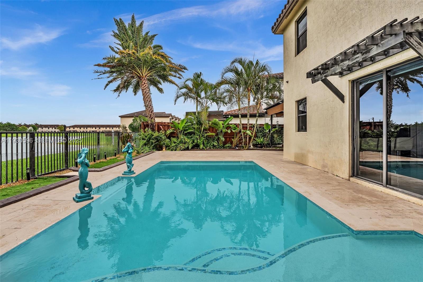 11709 Southwest 253rd Street Homestead, FL 33032 - Photo 38 of 47 a view of a backyard with potted plants