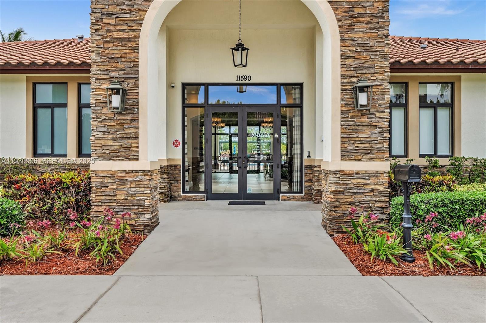 11709 Southwest 253rd Street Homestead, FL 33032 - Photo 40 of 47 front view of a house with a porch