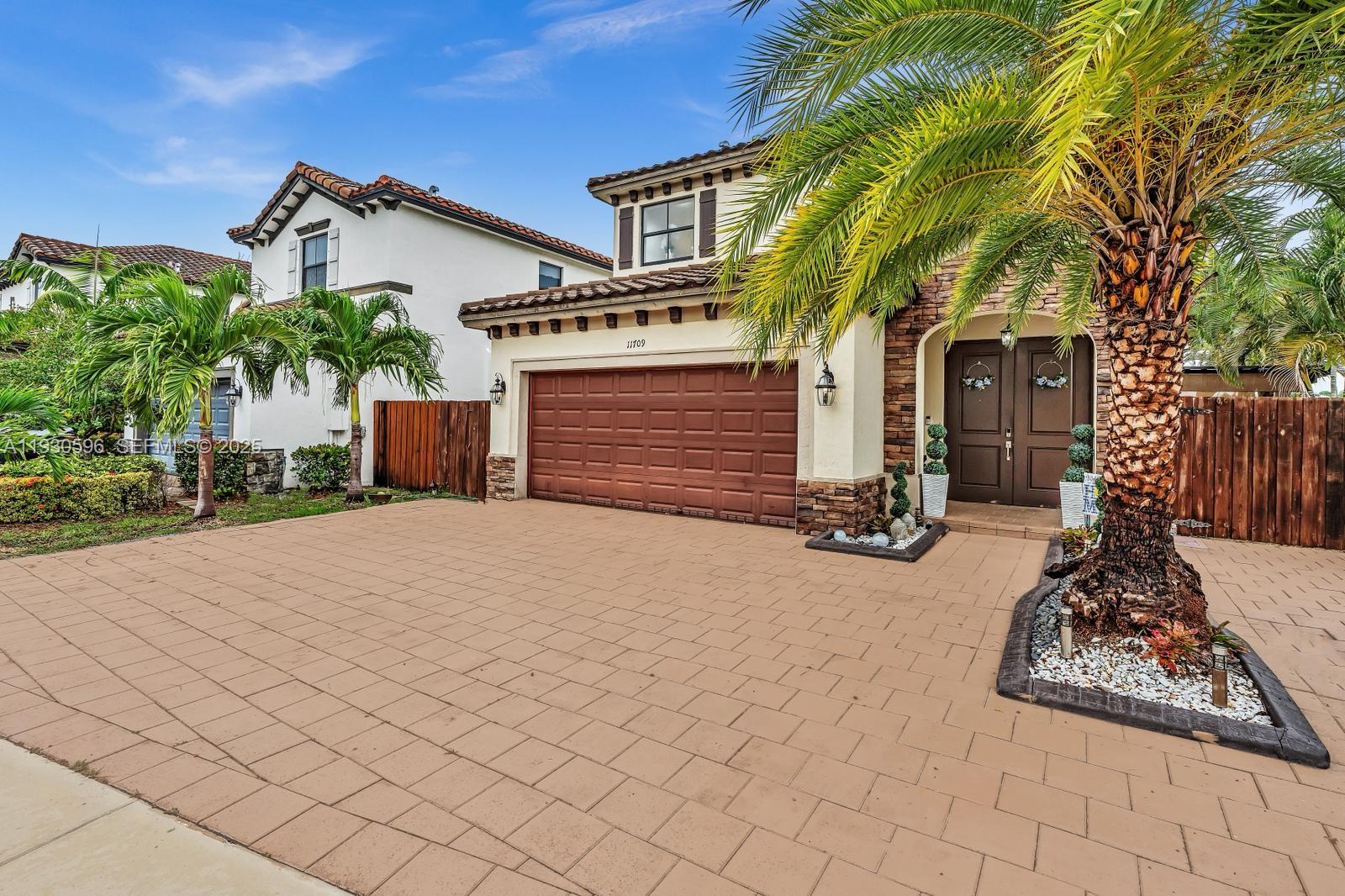 11709 Southwest 253rd Street Homestead, FL 33032 - Photo 4 of 47 front view of a house with a yard