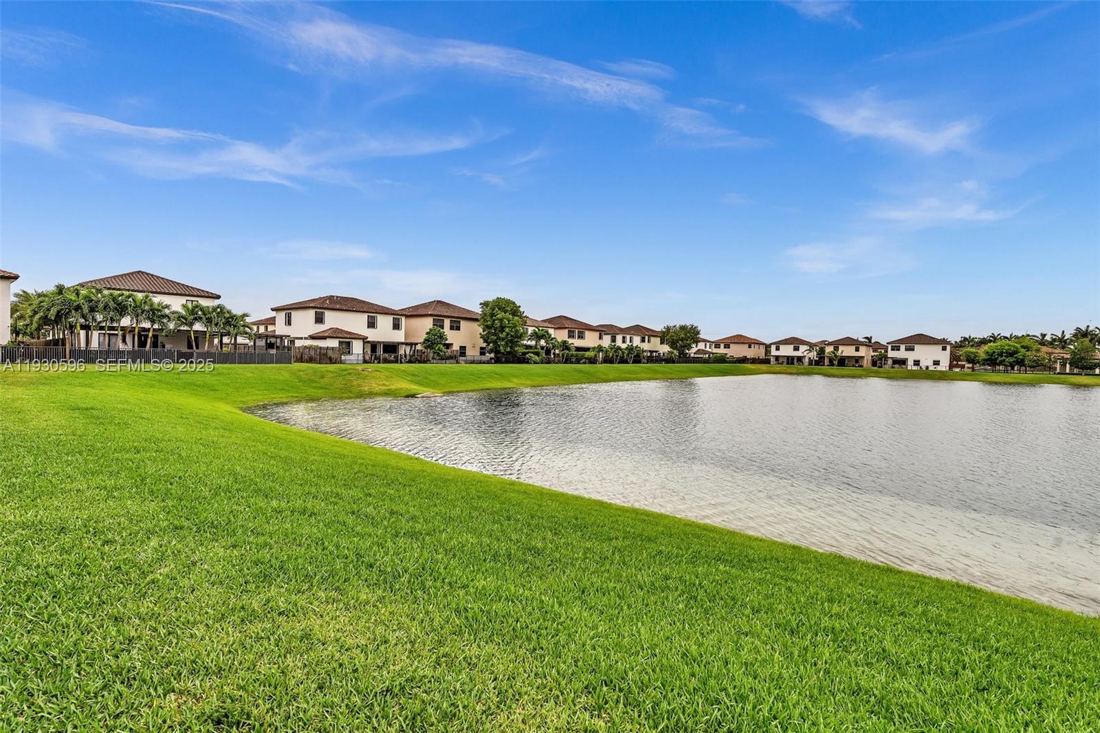 11709 Southwest 253rd Street Homestead, FL 33032 - Photo 43 of 47 a view of a lake with houses in the back