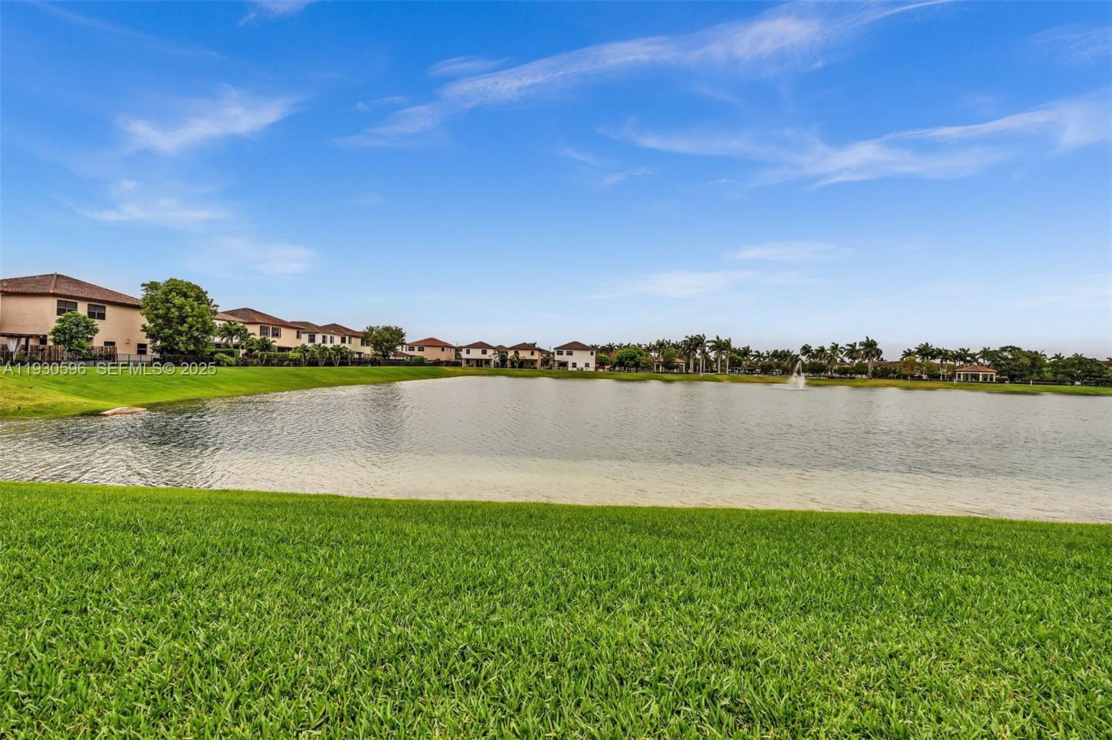 11709 Southwest 253rd Street Homestead, FL 33032 - Photo 44 of 47 a view of a lake with houses in the back