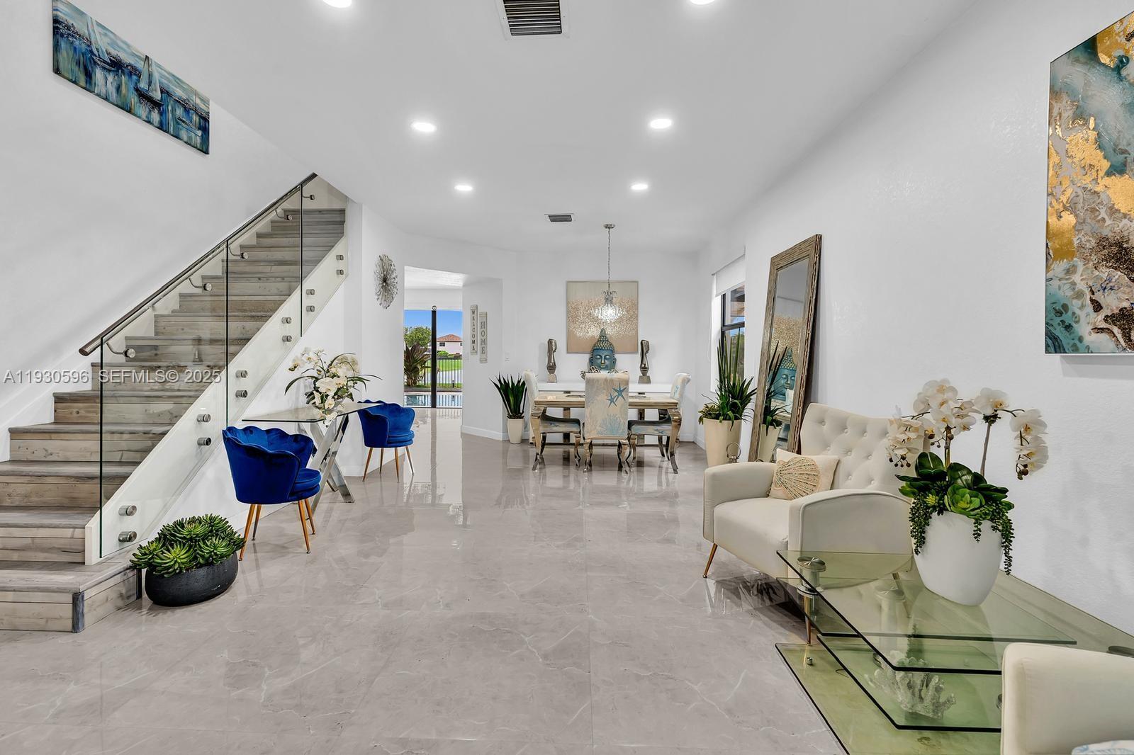 11709 Southwest 253rd Street Homestead, FL 33032 - Photo 6 of 47 a living room with furniture and a potted plant