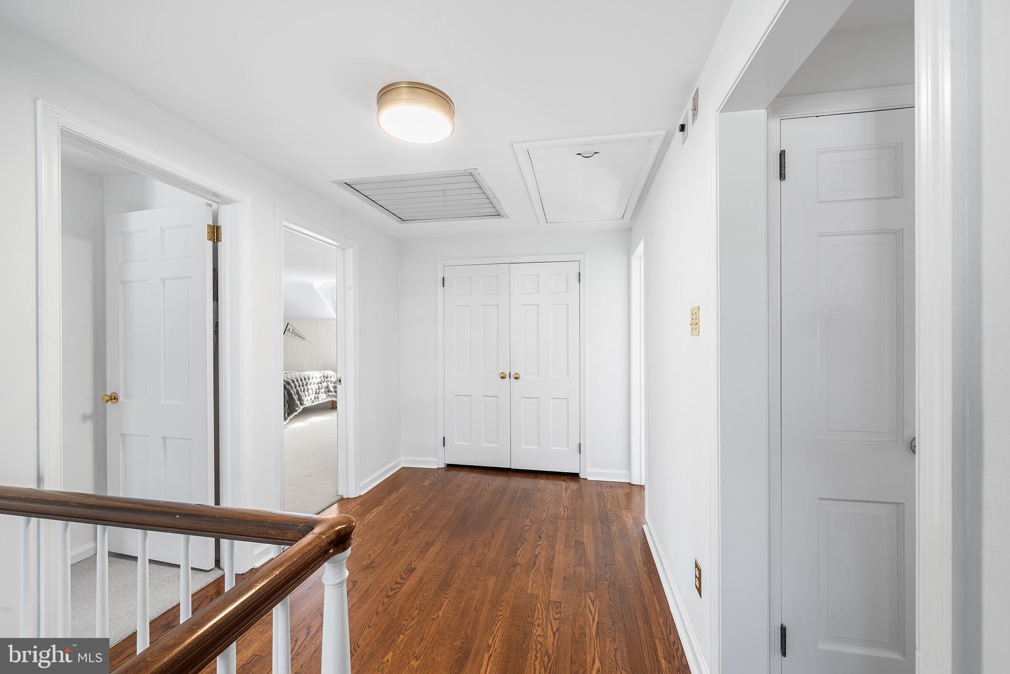 130 Colket Lane Devon, PA 19333 - Photo 15 of 34 a view of a hallway with wooden floor and staircase
