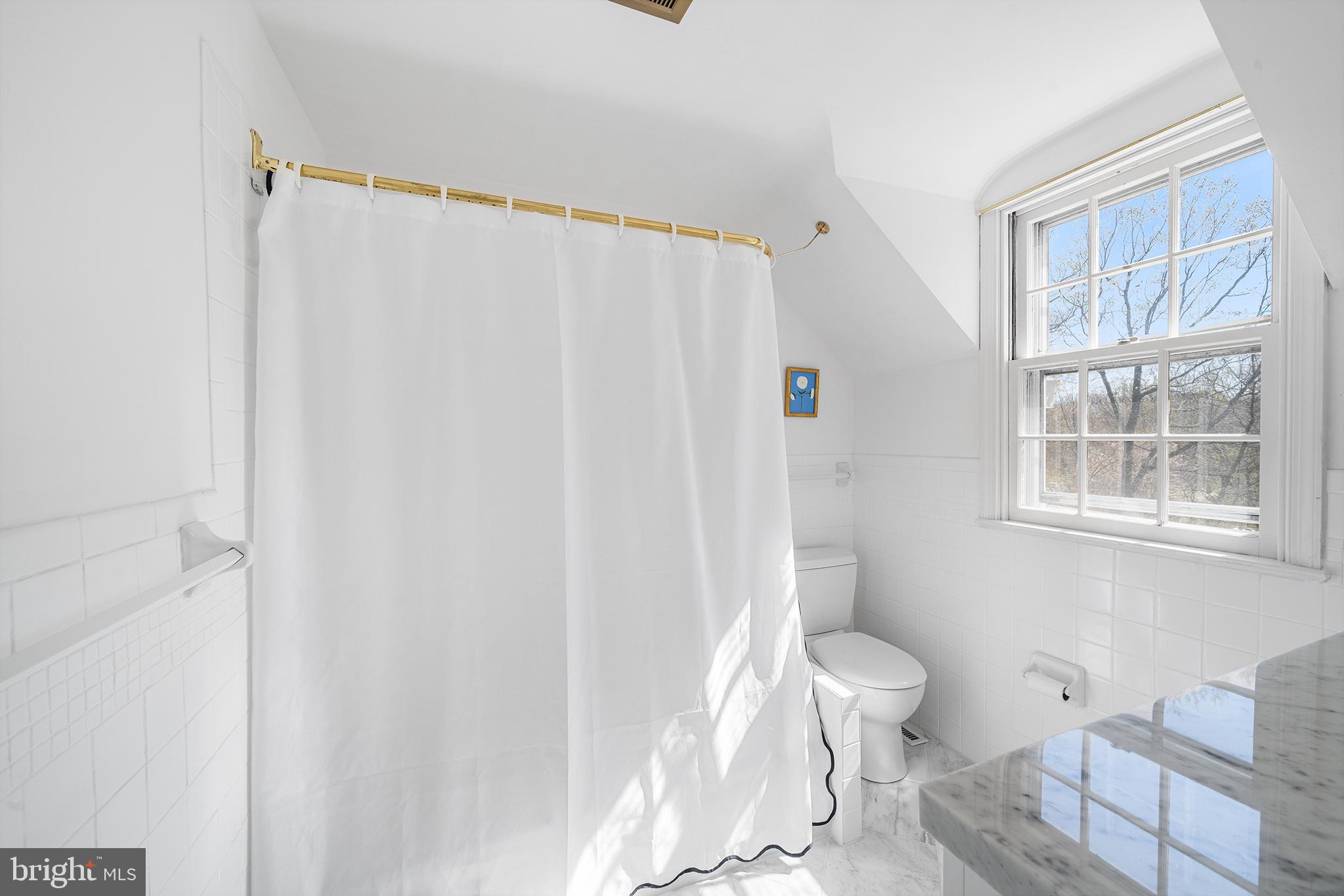 130 Colket Lane Devon, PA 19333 - Photo 19 of 34 a white toilet sitting next to a bathroom sink