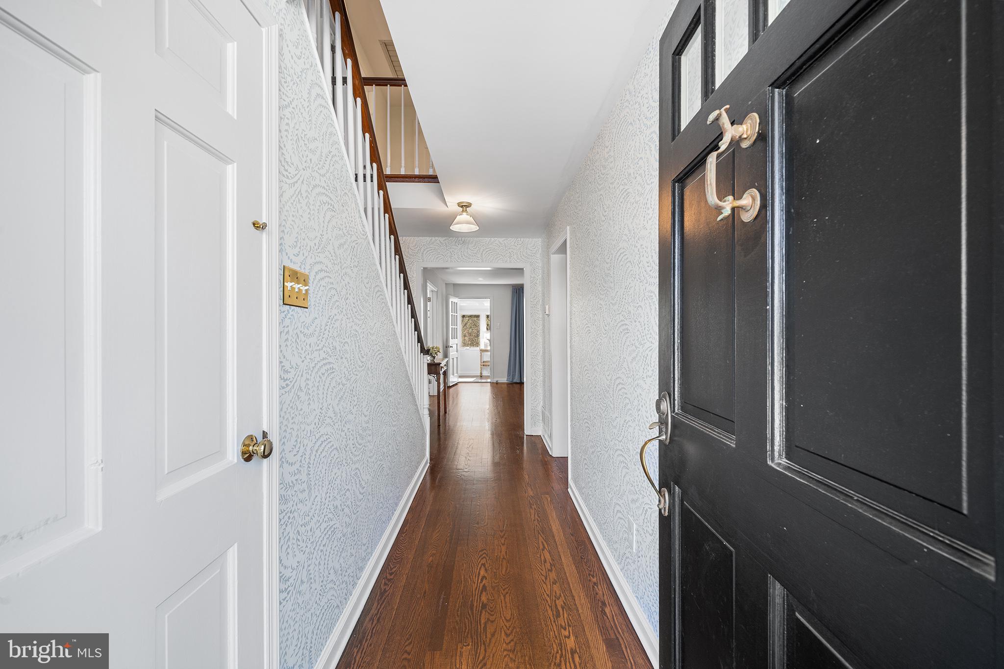 130 Colket Lane Devon, PA 19333 - Photo 3 of 34 a view of a hallway with wooden floor and staircase