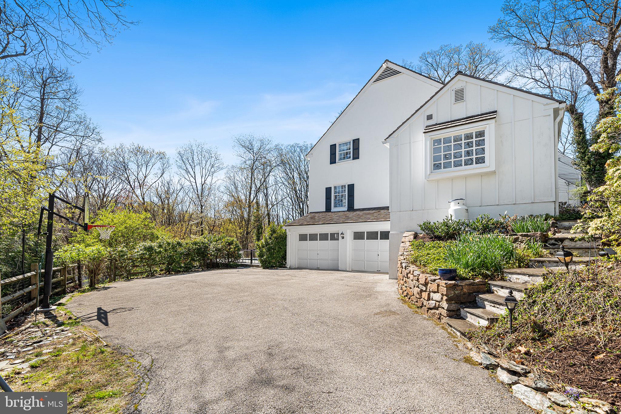 130 Colket Lane Devon, PA 19333 - Photo 32 of 34 a view of a white house with a yard and potted plants