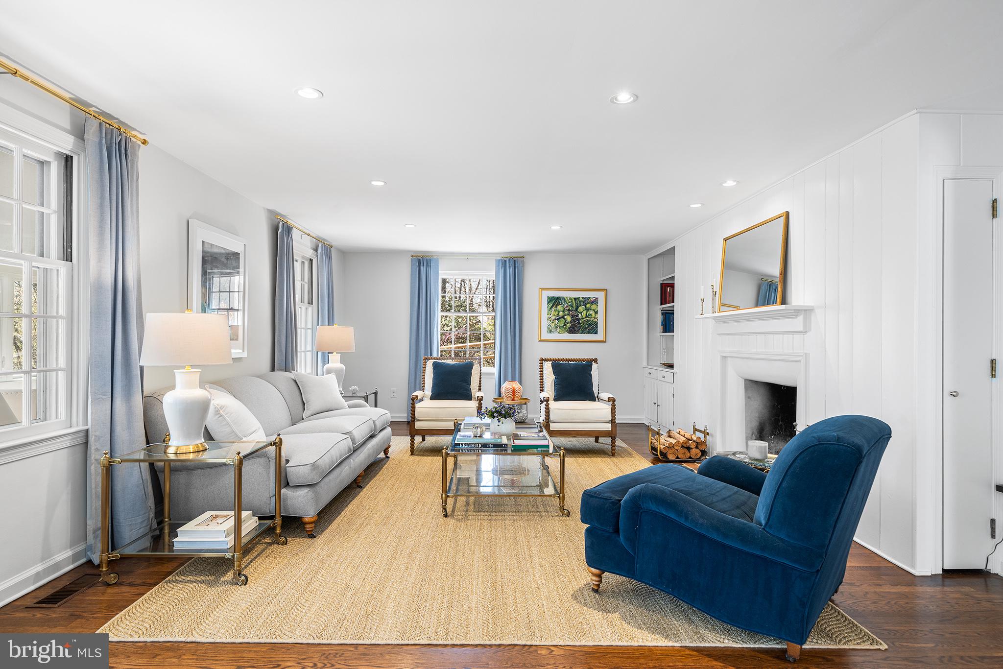 130 Colket Lane Devon, PA 19333 - Photo 6 of 34 a living room with fireplace furniture and a large window