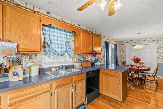 a kitchen with a stove and a refrigerator
