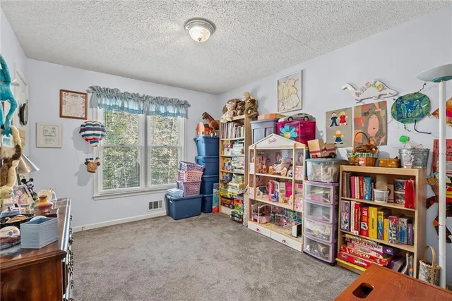 a view of a storage room with racks on the wall