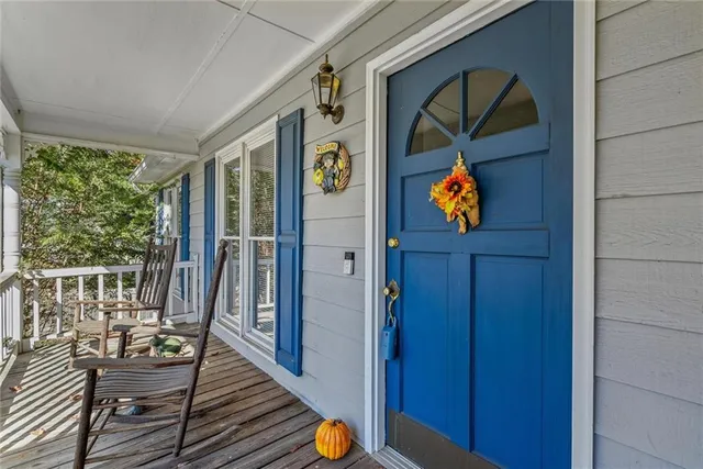 a view of an entryway with wooden floor