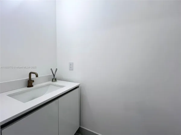 a bathroom with a sink toilet and bathtub