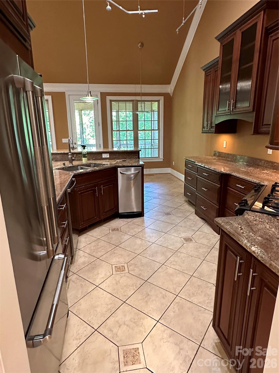 26 Stone House Road Arden, NC 28704 - Photo 11 of 21 a kitchen with stainless steel appliances granite countertop a stove a sink and a refrigerator