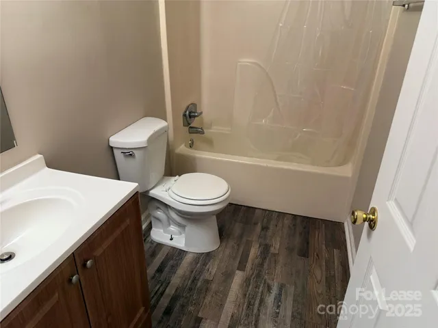 a bathroom with a sink a toilet and a bathtub
