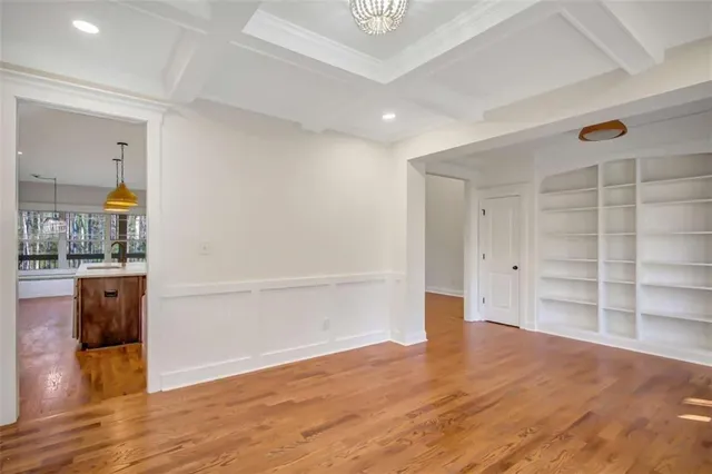 a kitchen with white cabinets and a stove
