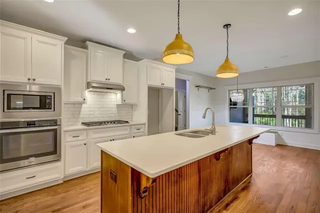 a bathroom with a sink and a shower