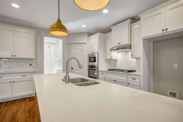 a view of a livingroom with furniture and wooden floor