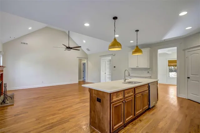 an empty room with windows and entrance