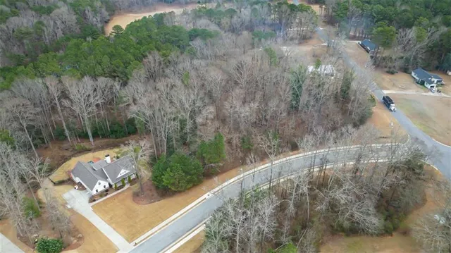 a view of a room with wooden floor and window