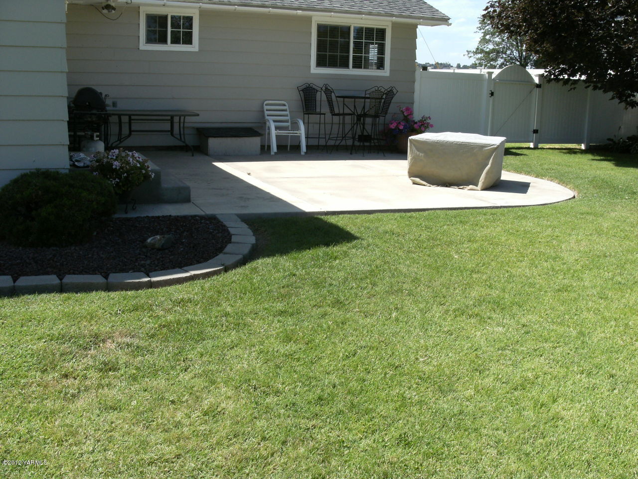 1628 Saul Road Sunnyside, WA 98944 - Photo 6 of 10 a view of a house with backyard and sitting area