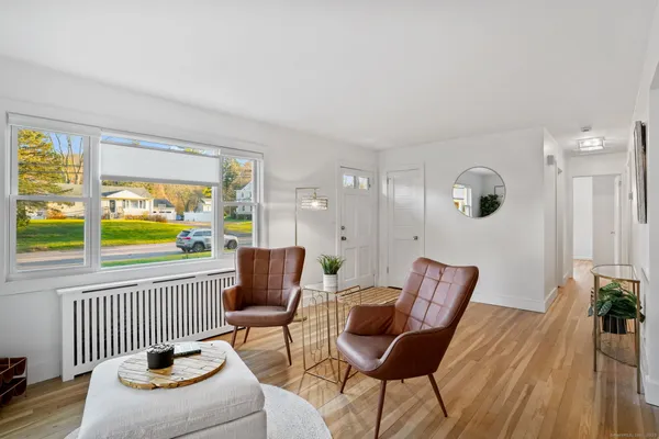 a living room with furniture and a window