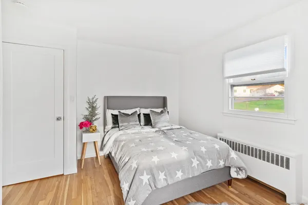 a bedroom with a bed and a closet