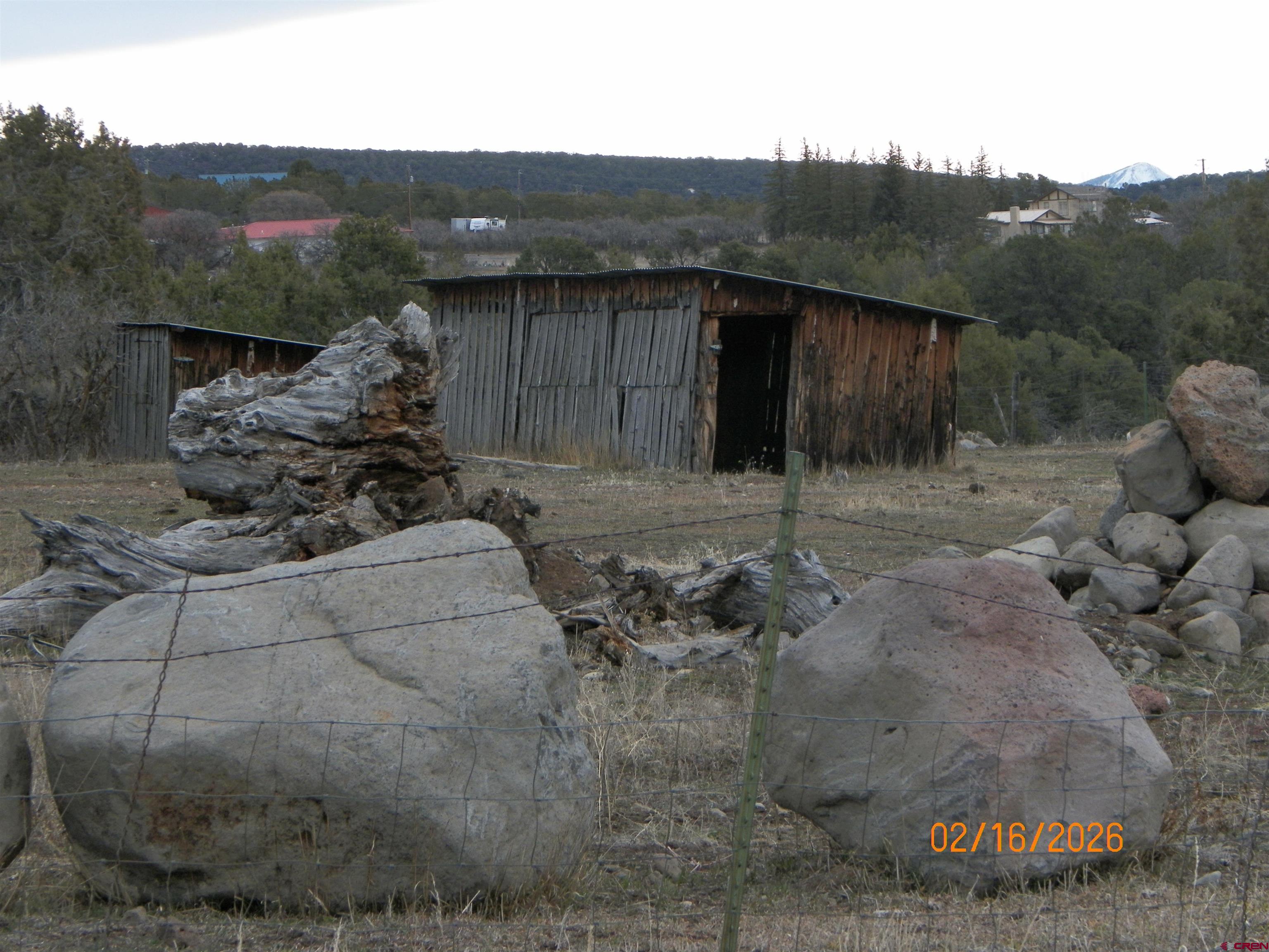 20856 2300th Road Cedaredge, CO 81413 - Photo 40 of 45 a view of a backyard with barn in the background