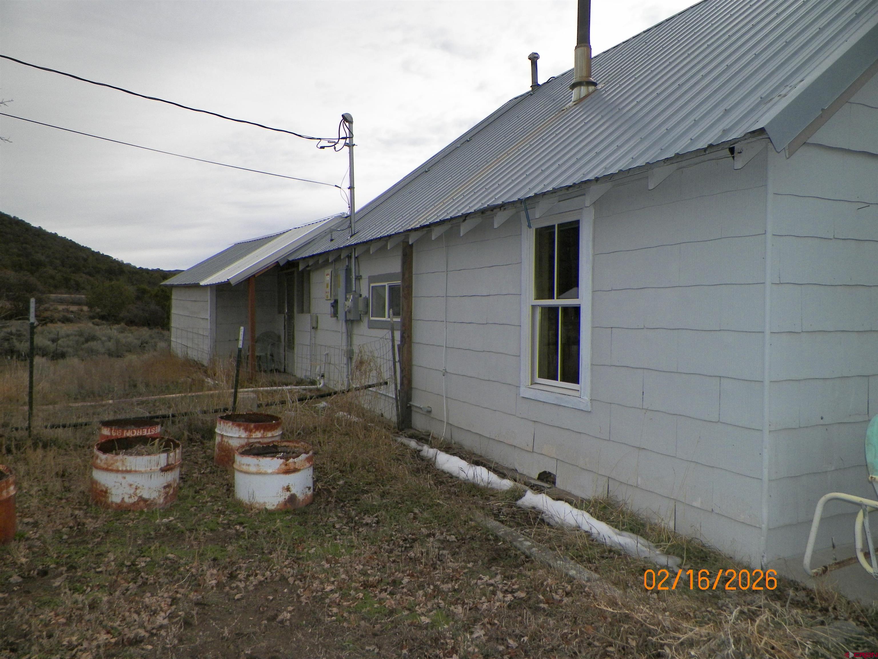 20856 2300th Road Cedaredge, CO 81413 - Photo 7 of 45 a backyard of a house with outdoor seating