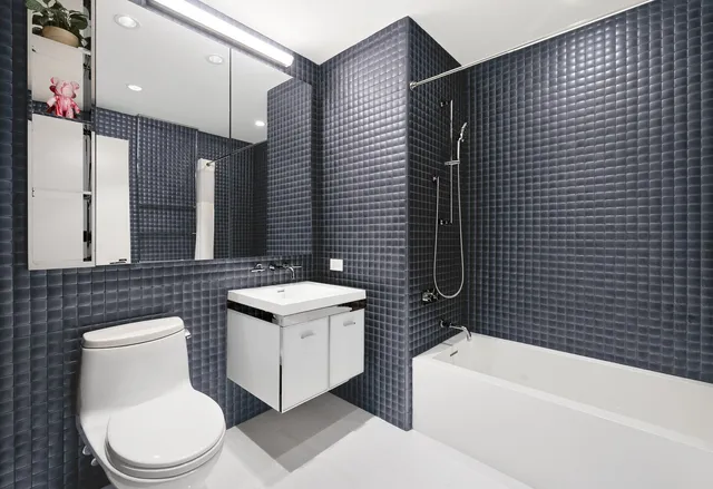 a bedroom with a large bed and a large window