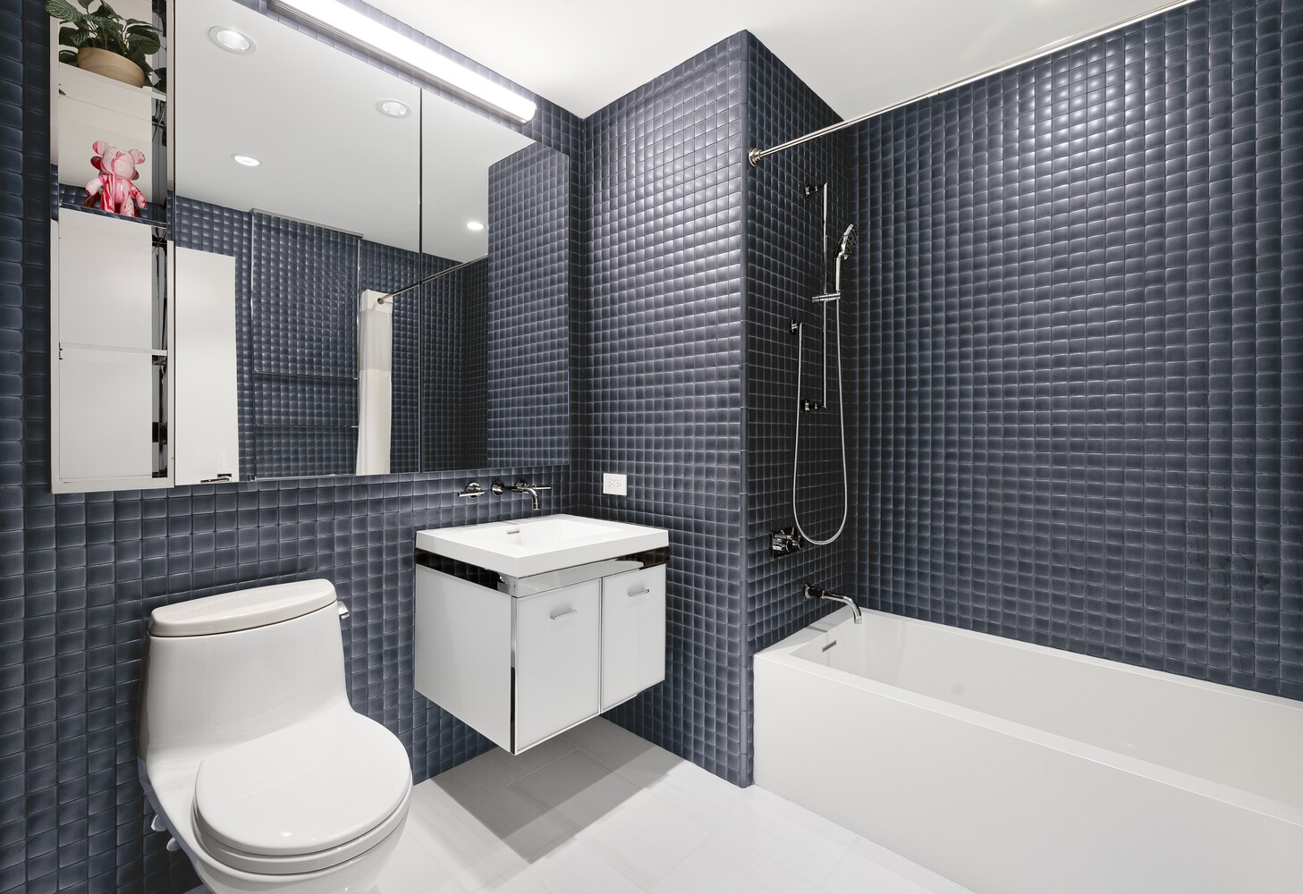 252 South Street, Unit 36C Manhattan, NY 10002 - Photo 12 of 32 a bathroom with a sink a toilet and bathtub