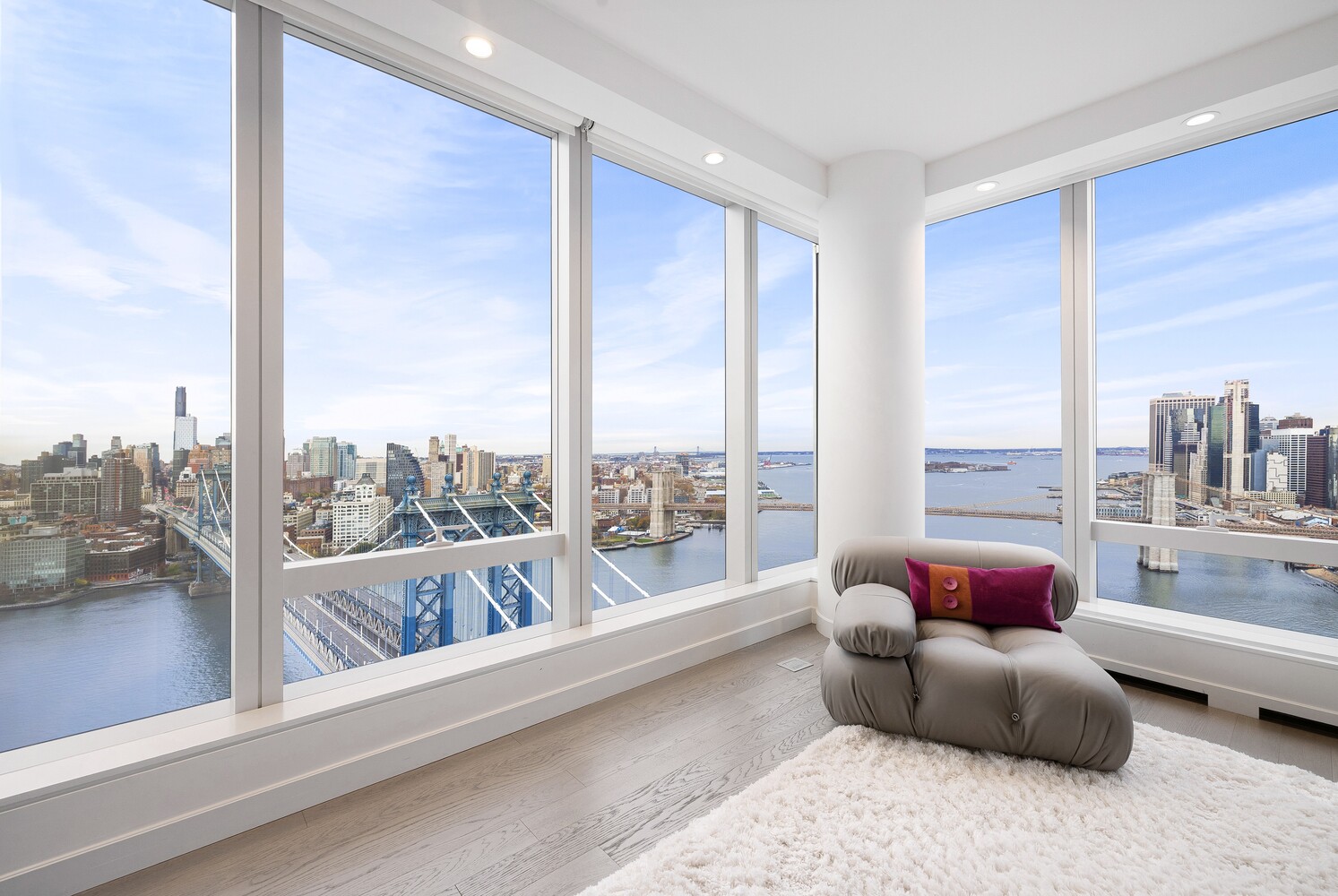 252 South Street, Unit 36C Manhattan, NY 10002 - Photo 2 of 32 a living room with couch and a floor to ceiling window