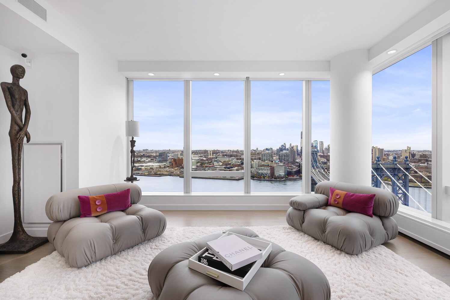 252 South Street, Unit 36C Manhattan, NY 10002 - Photo 5 of 32 a living room with furniture and a large window