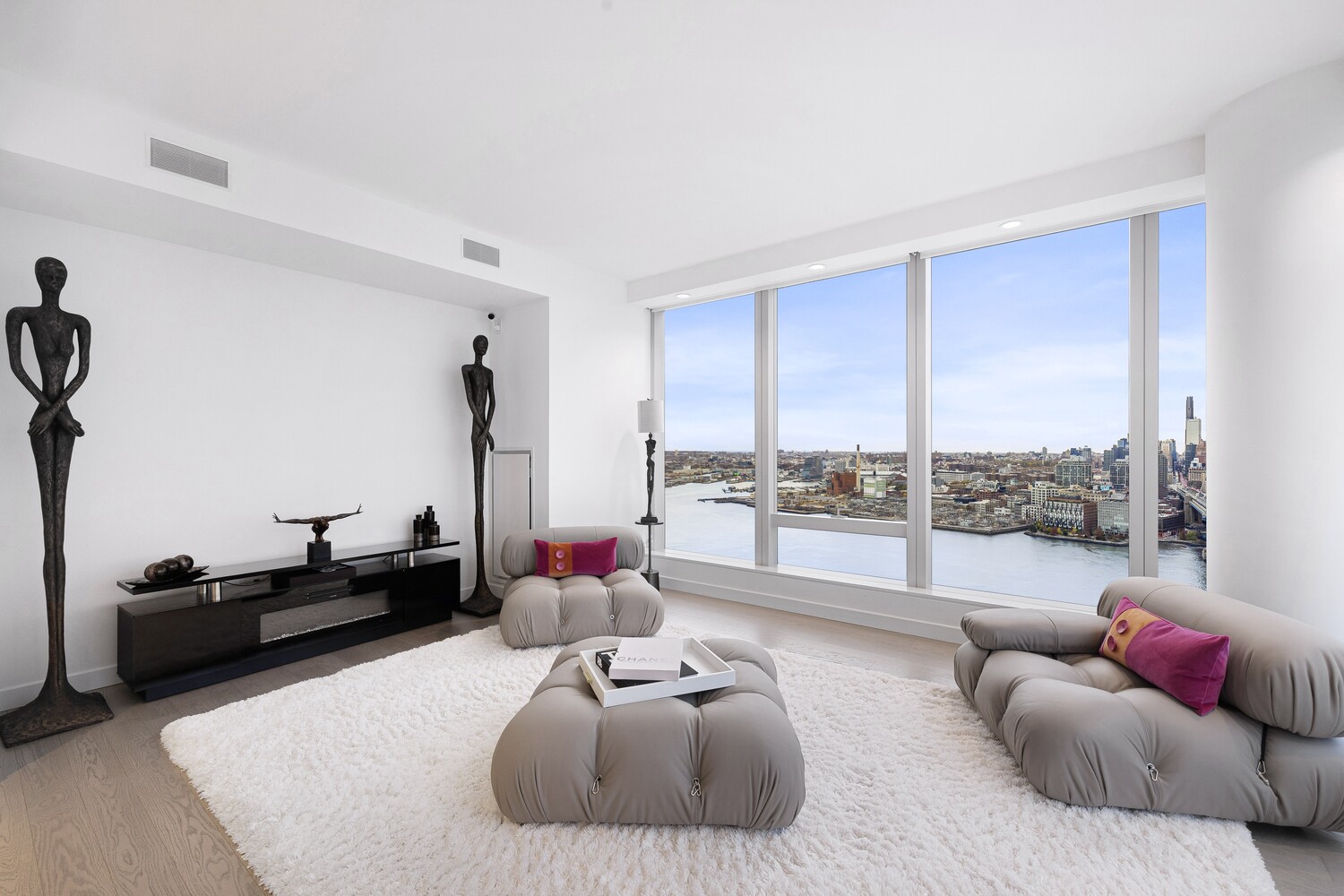 252 South Street, Unit 36C Manhattan, NY 10002 - Photo 6 of 32 a living room with furniture and a large window