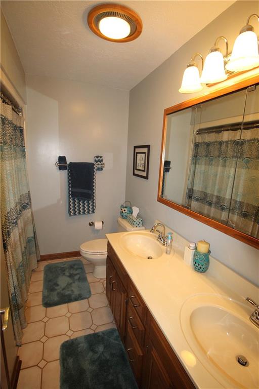 306 Sygan Road McDonald, PA 15057 - Photo 14 of 24 Main bath has a double bowl vanity sink.