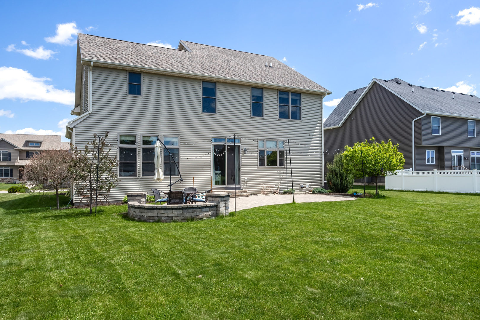 5700 Emily Road Bettendorf, IA 52722 - Photo 51 of 58 a front view of a house with a garden and plants