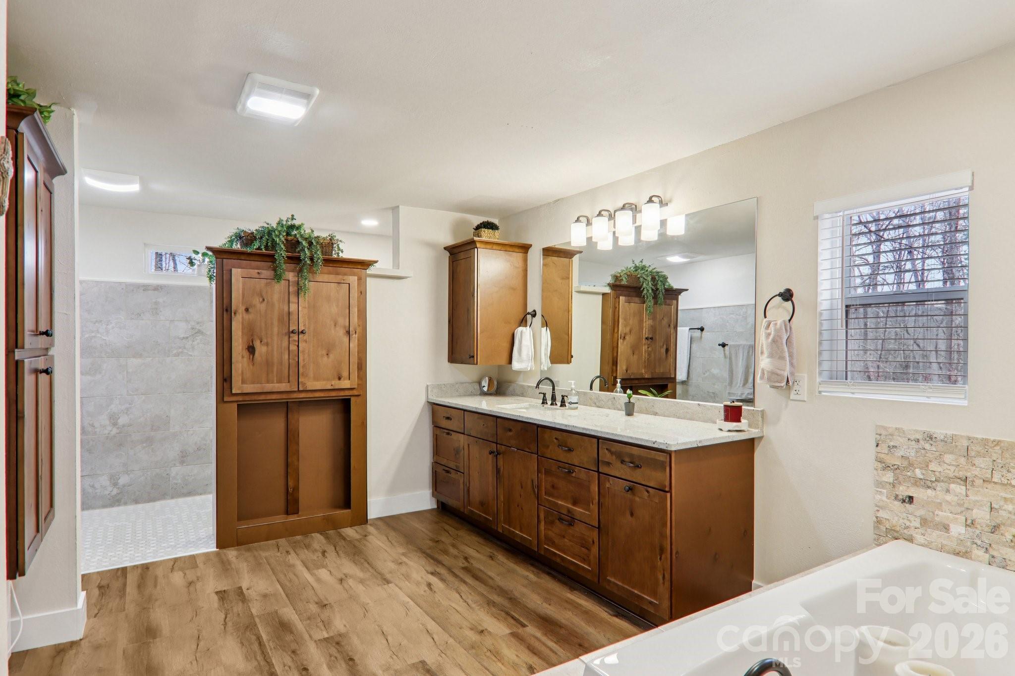 159 Broken Bow Run Pickens, SC 29671 - Photo 11 of 23 a bathroom with a double vanity sink a mirror and a shower