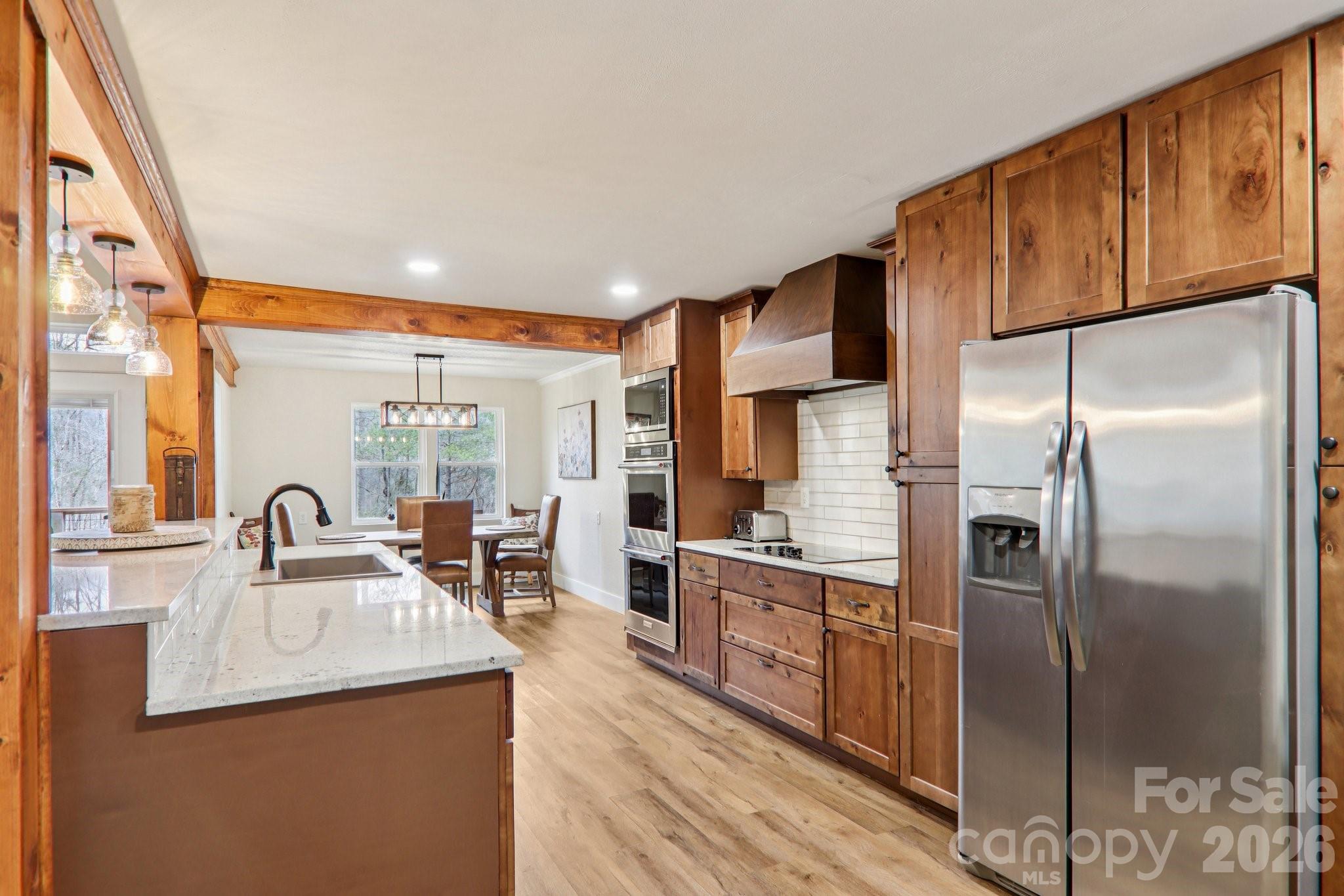 159 Broken Bow Run Pickens, SC 29671 - Photo 7 of 23 a kitchen with stainless steel appliances granite countertop a sink a stove and refrigerator