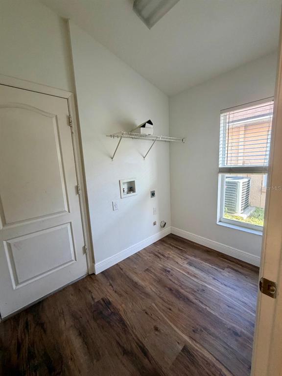 11147 Rodeo Lane Riverview, FL 33579 - Photo 3 of 6 a view of empty room with wooden floor and fan