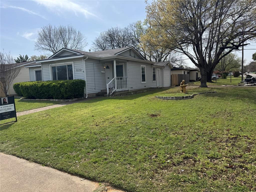 629 Harrison Lane Hurst, TX 76053 - Photo 20 of 20 a front view of house with yard and green space