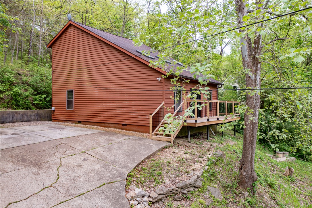 10584 New Biddinger Road Harrison, OH 45030 - Photo 57 of 61 This charming home features a lovely deck overlooking a lush, treed landscape.