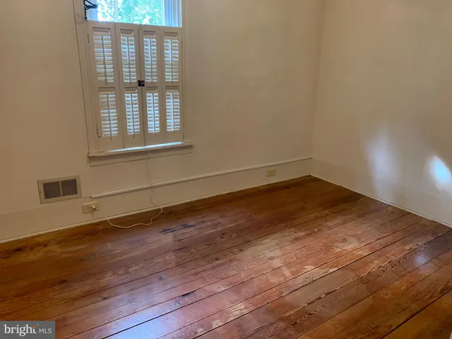a bathroom with a sink a toilet and a shower